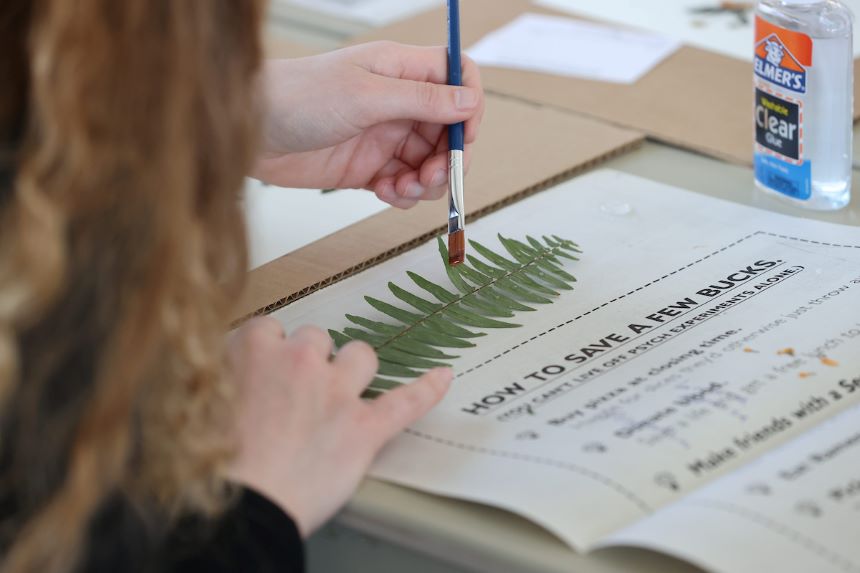 Student works on herbarium art.