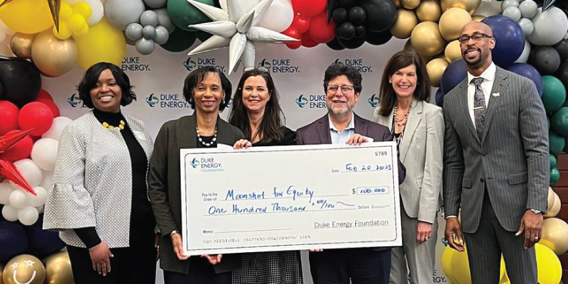 Duke Energy presenting a check to Miami Regionals Moon Shot for Equity. 