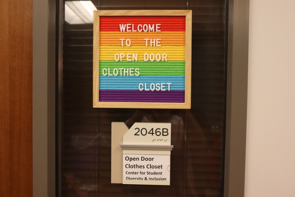 Rainbow sign reading Welcome to the Open Door Clothes Closet. 2046B Center for Student Diversity and Inclusion
