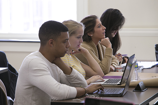 Four students working in a computer training class.