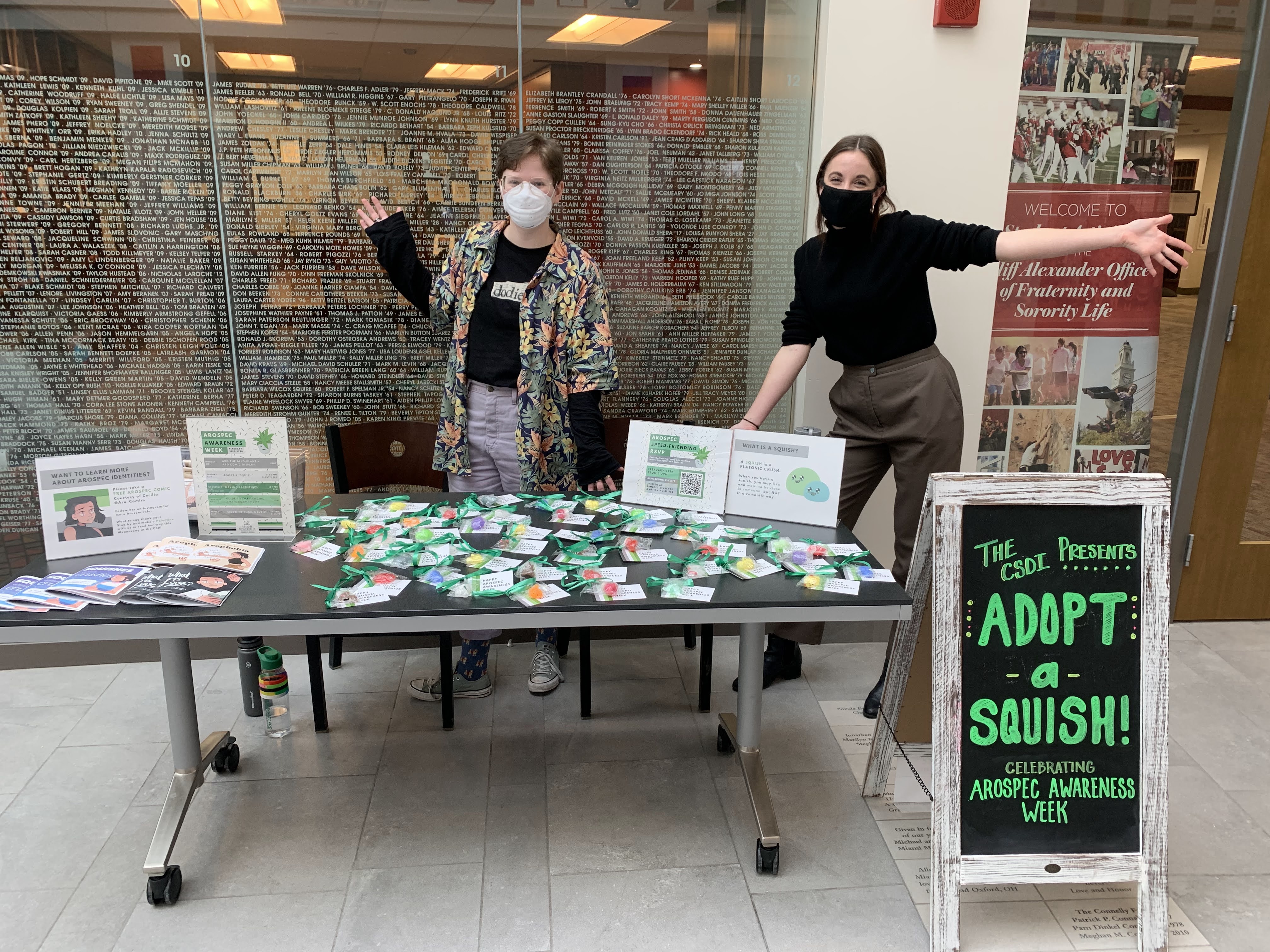 two people standing behind a table with aerospec material