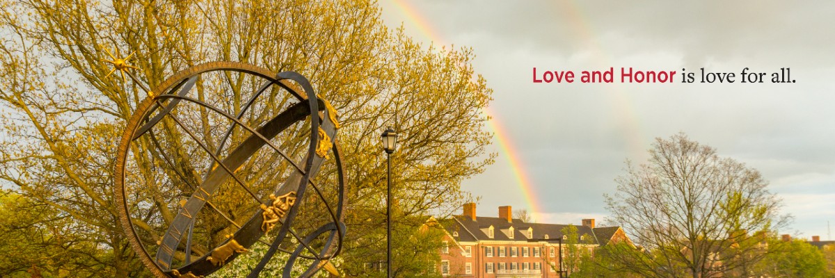 Love and Honor is love for all. Image of campus sundial and rainbow in spring.