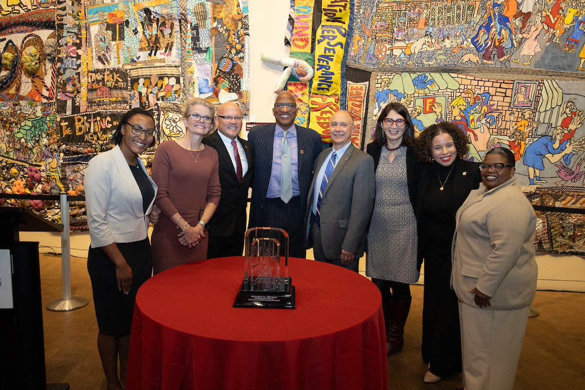 Photo of a group of Miami faculty, staff, and students with Wil Haygood