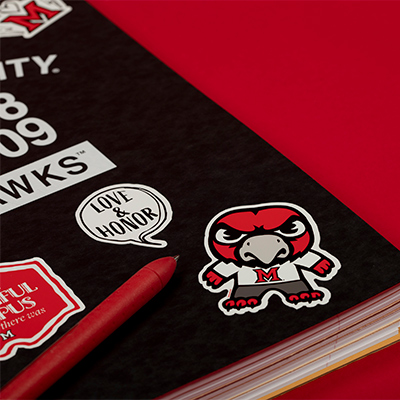 Miami branded stickers on a notebook