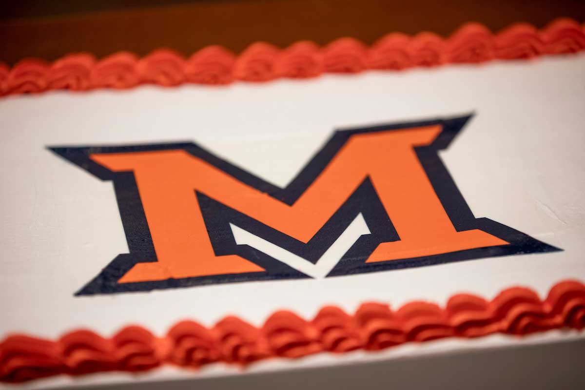 a cake decorated with the Miami University Beveled M