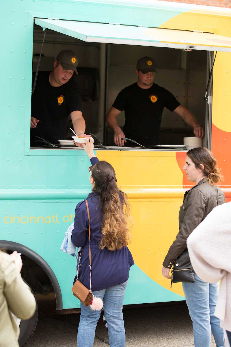 two people ordering at a food truck window